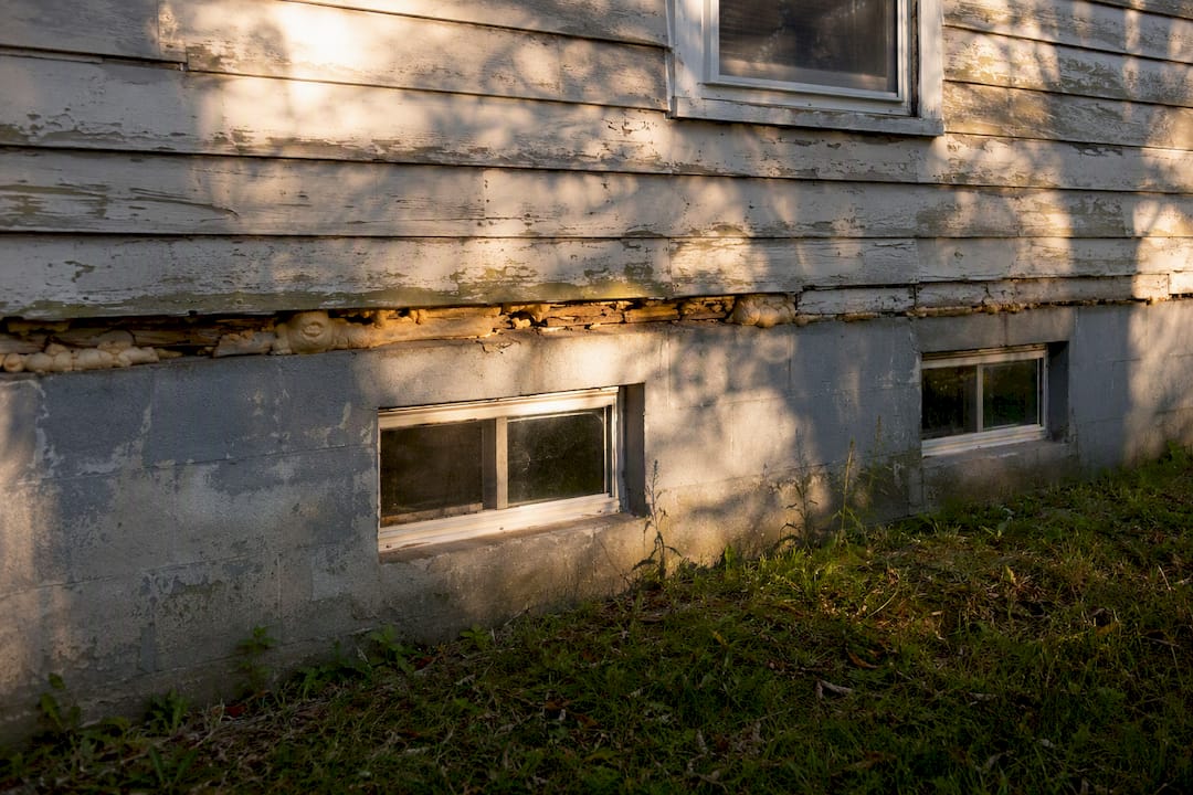 Close-up of deteriorated foam insulation in house walls