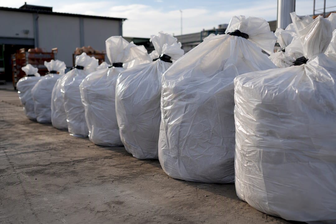Double-bagged asbestos waste ready for disposal